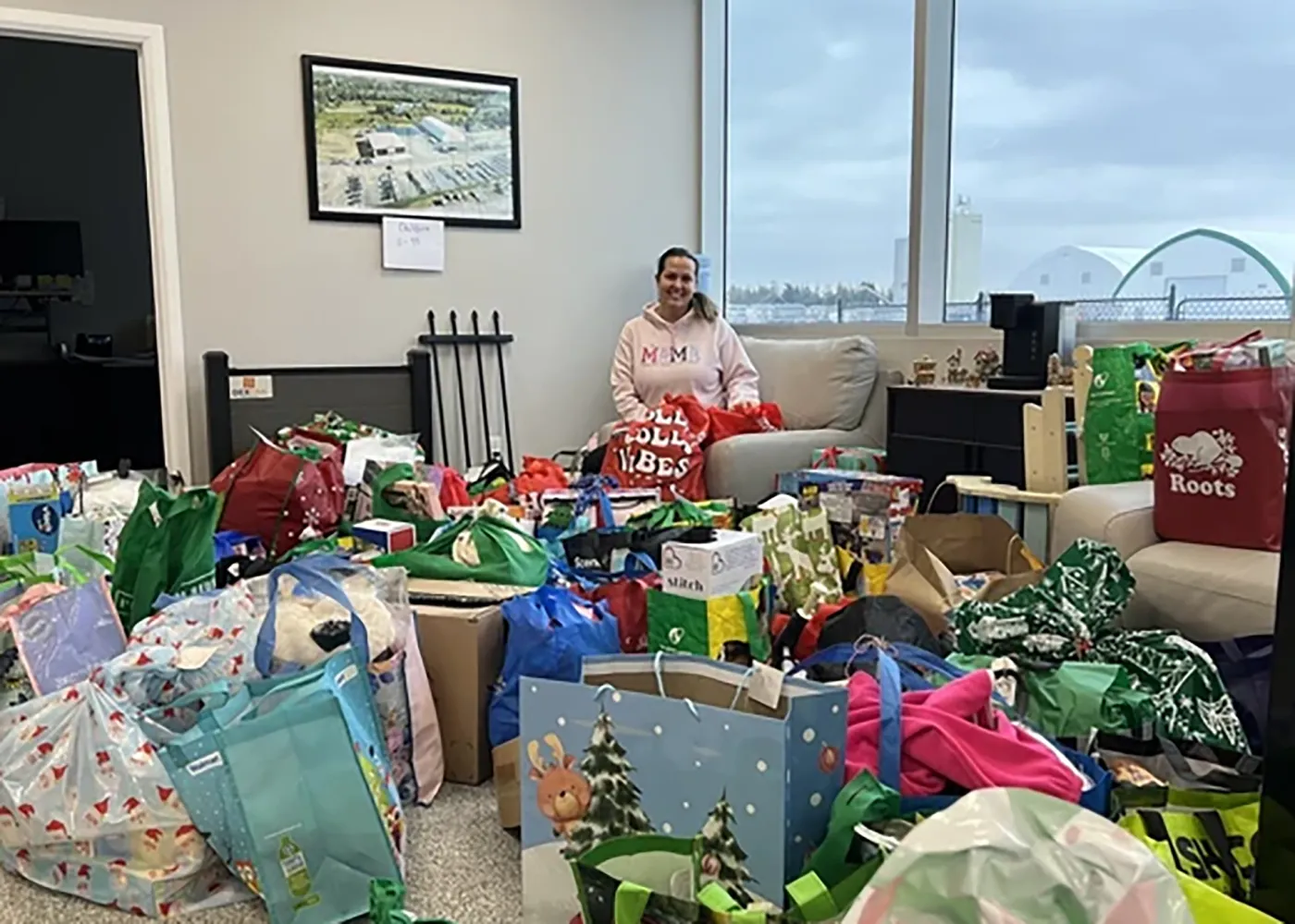 Courtnie Storms organizing donated holiday gifts