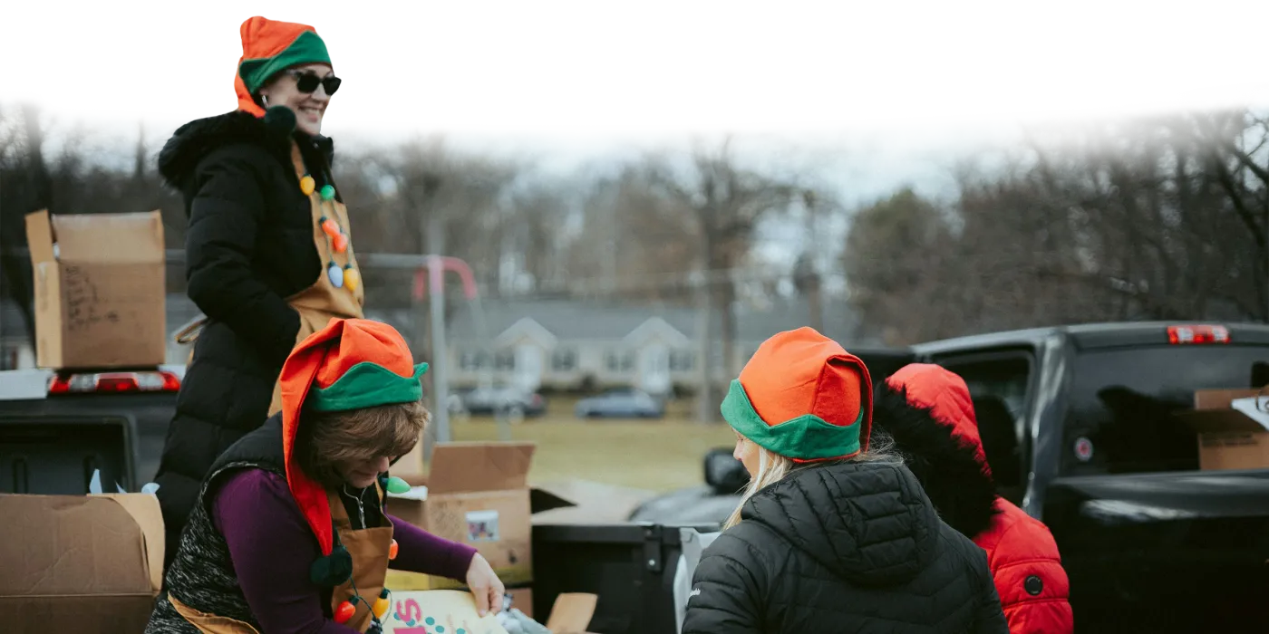 Volunteers sharing holiday gifts
